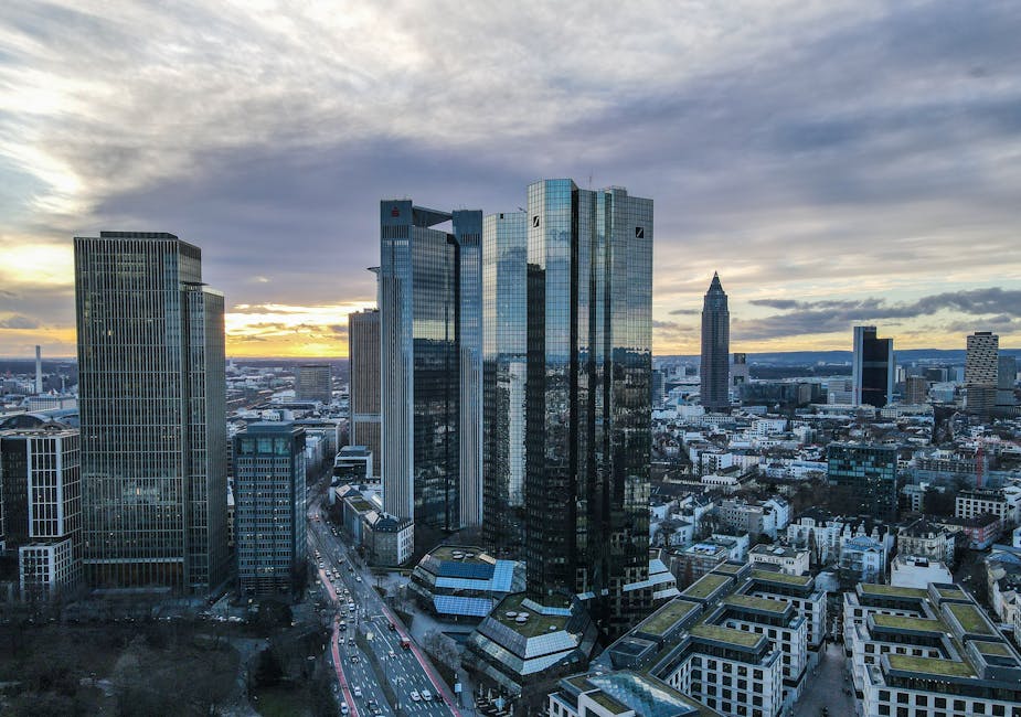 Aerial view of Frankfurt's financial district skyscrapers during a stunning sunset.